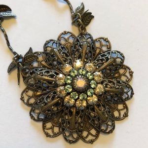 Antique gold finish with floral motif pendant